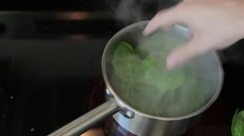 Boiling some spinach Stock Footage