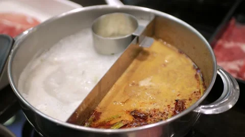 Boiling soup in a hotpot ready to make shabushabu in Japanese style. Hotpot Asia Stock Footage 189947197