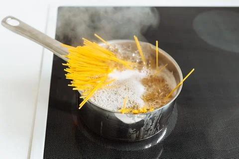 Boiling spaghetti in boiling water Stock Photos