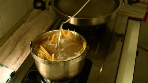 Boiling Spaghetti in Stainless Steel Pot with Close Up Cooking Process Stock Footage 340953936