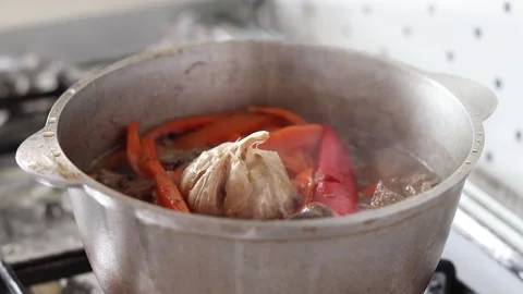 Boiling stew with meat and vegetables. Stock Footage 153430477