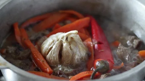Boiling stew with meat and vegetables. Stock Footage 153430479