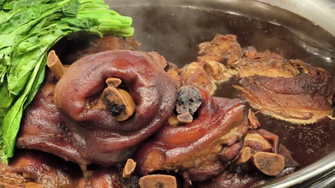 Boiling stewed pork leg delicious Thai street food in Bangkok, Thailand. Stock Footage 294292575