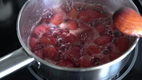 Boiling strawberry jam, close-up. Cooking process. Stock Footage 345494362