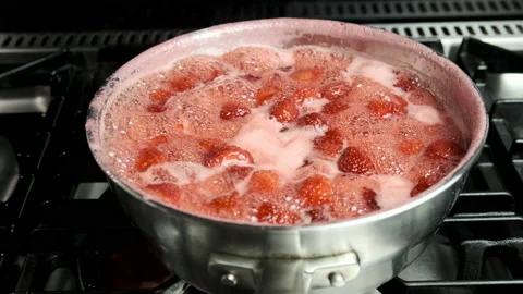 Boiling strawberry jam / jelly over stove 4k 60fps Stock Footage 140144007