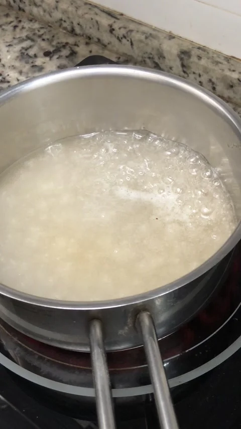 Boiling sugar in a pot Stock Footage 306420148