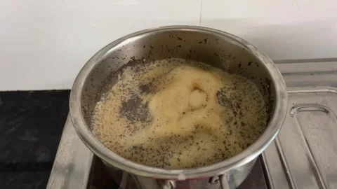 Boiling Tea in Pot | Hot Chai Cooking on Stove for Traditional Beverage Видео 315625042