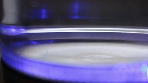 Boiling a teapot with a blue light in real time Stock Footage 135044153