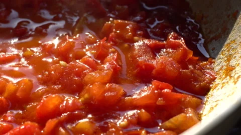 Boiling tomato sauce.  Pan Left. Close up. Stock Footage 136044631