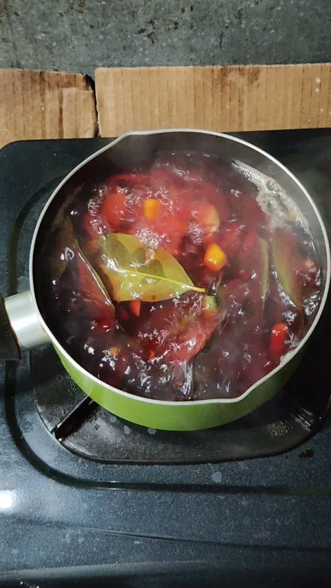 Boiling various plants to make a beneficial drink Stock Footage 280216079