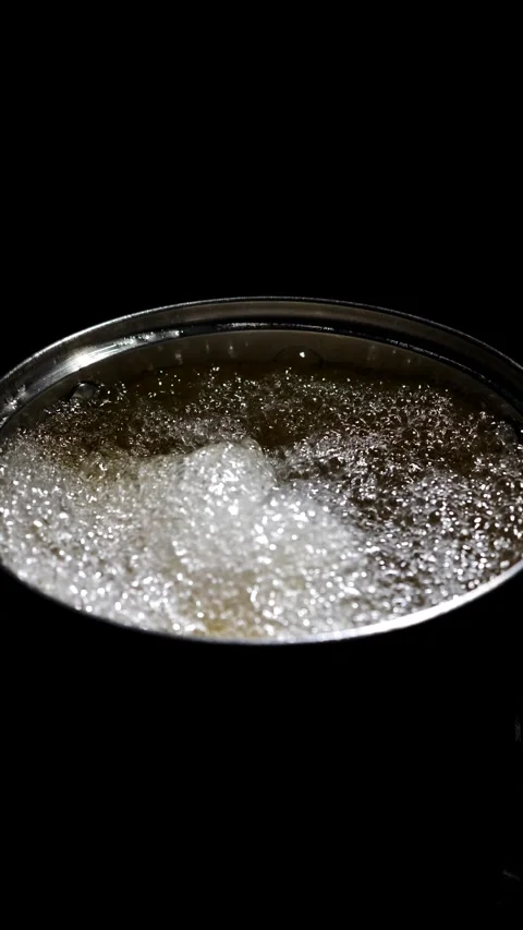 Boiling vegetable oil in a pan. Stock Footage 309313888