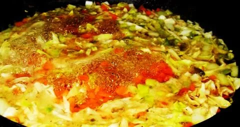 Boiling vegetable preparation with multicolored patterns Stock Photos