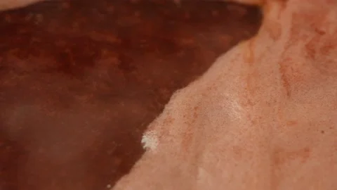 Boiling viburnum jam with pulp in a close-up. Side view. Stock Footage 165993118