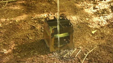 Boiling Water and Coffee over Wood Stove Campfire. Cup of Water Boiling Stock Footage 306533157