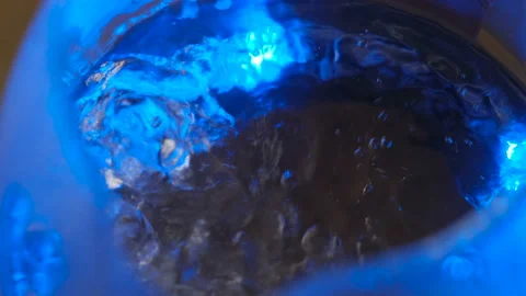 Boiling water background in neon light, close-up Stock Footage 126349158