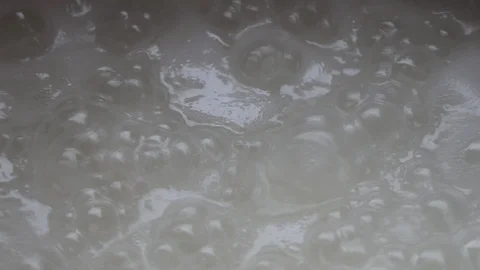 Boiling water boiled rice Stock Footage 104842963