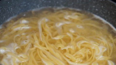 Boiling water. A boiling water in pot slowmotion	 Stock Footage 116765005