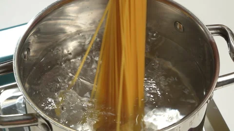 Boiling Water with Bubbles in Stainless Steel Pot Video stock 345770545