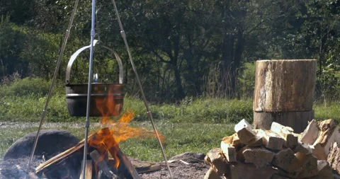 Boiling water in a cauldron over a fire. Stock Footage 277116286