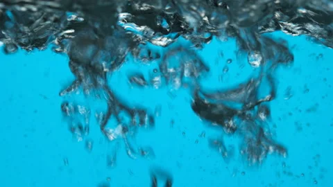 Boiling water close up on blue background. 4K UHD video Stock Footage 160653836