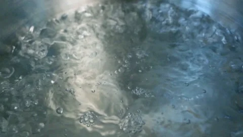 Boiling Water, Close-up, Slow Motion. Water Bubbles when Boiling. Water Boils in Stock Footage 157764354