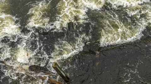 Boiling water in a cold river. Abstract background. Space for text. Stock Photos