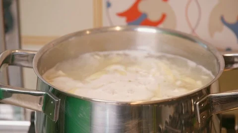 Boiling water that comes out of the pot Stock Footage 126314655