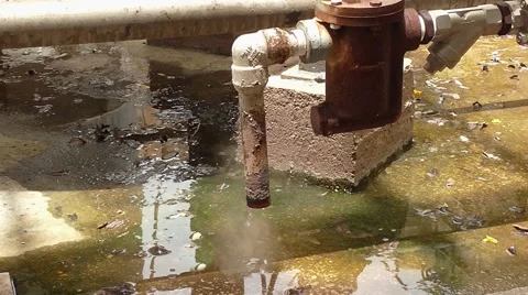 Boiling water dripping from the rusty pipe Stock-Footage 41678136