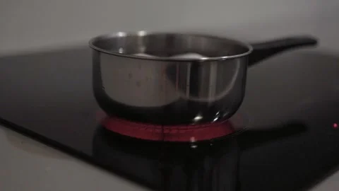 Boiling water with eggs in a kitchen. Video stock 311805448
