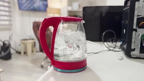 Boiling Water in Electric Kettle on Office Desk Vídeo Stock 340185966