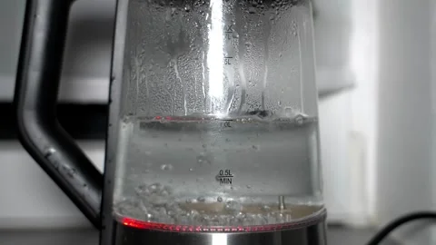 Boiling Water in Electric Kettle in Slow Motion Stockbeeldmateriaal 319449638
