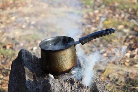 Boiling water on the fire Stockfoto's