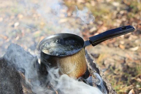 Boiling water on the fire Stock Photos