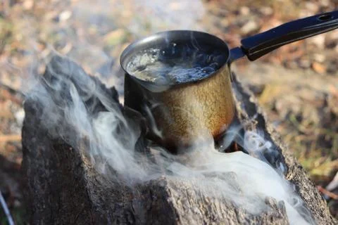Boiling water on the fire Stock Photos