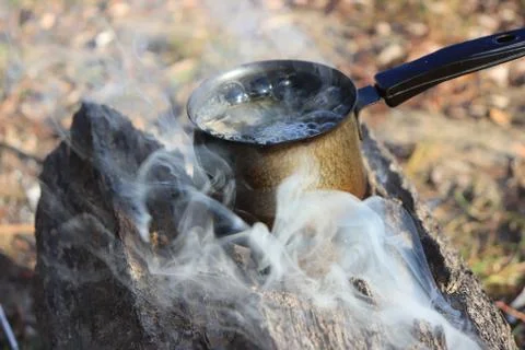Boiling water on the fire Stock Photos