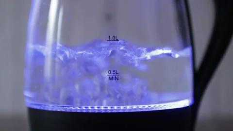 Boiling water in a kettle with blue lights Stock Footage 130185072