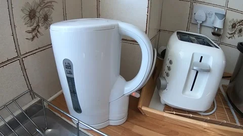 Boiling Water in The Kettle with Kitchen Sounds Stock Footage 137826799
