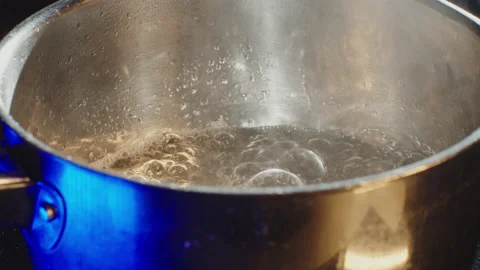 Boiling water in kitchen, cooking, preparing a cake. Stock Footage 149122150