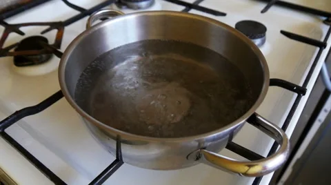 Boiling water in a kitchen pot Stock Footage 55437916