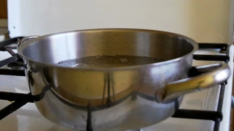 Boiling water in a kitchen pot Stock Footage 55438022