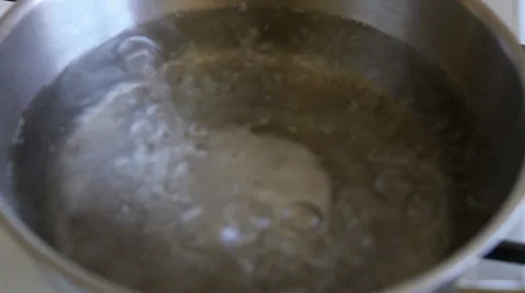 Boiling water in a kitchen pot Stock Footage 55438113