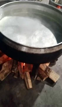 Boiling Water in Large Pot Over Wood Fire Stock Photos