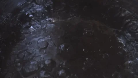 Boiling water in metallic saucepan close-up Stock Footage 248894345