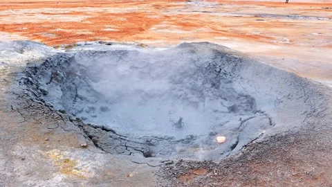 Boiling water in a mud spring in Hverir geothermal spring in Iceland Stock Footage 337737065