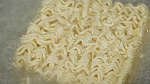Boiling water with noodles in the pan Stock Footage 73828166