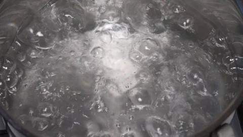 Boiling water in the pan Video stock 100670430