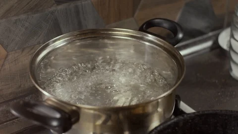 Boiling water in pan Stock Footage 126472113