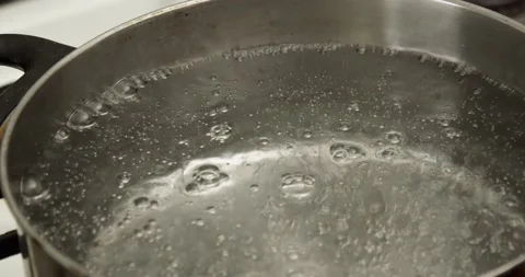 Boiling water in a pan Video stock 235512718