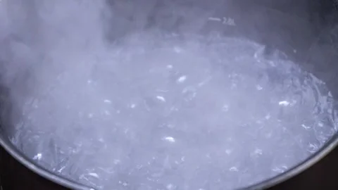 Boiling water in the pan Stock Footage 273984846
