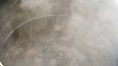 Boiling water in pot above the fire. Close up Stock Footage 72361730